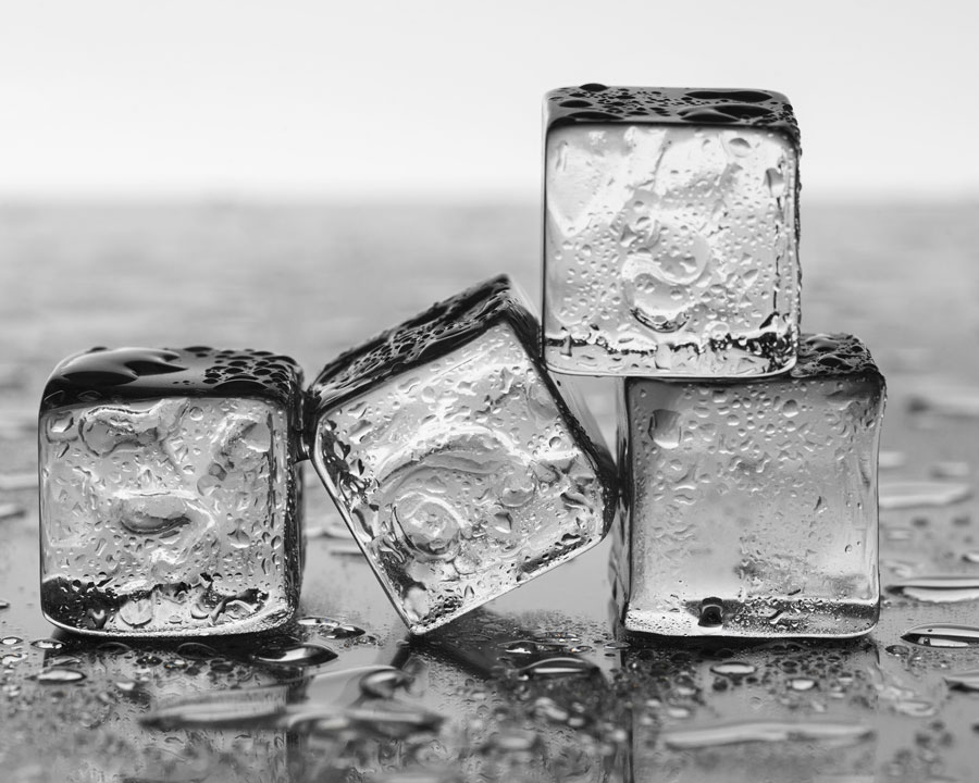 Ice cubes arranged on a black table