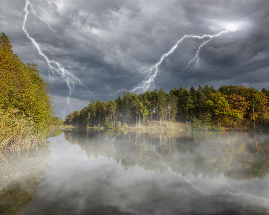 lightening and mist over pond